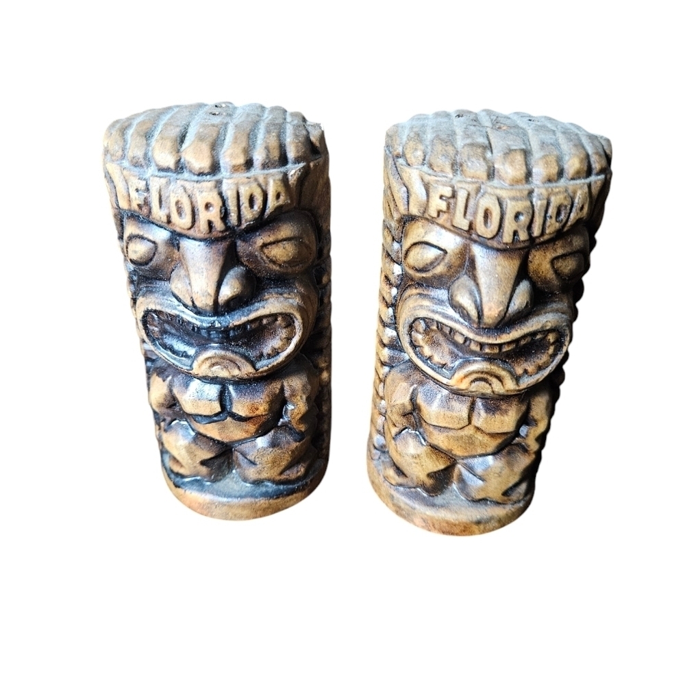 Set of vintage Florida ceramic tiki salt and pepper shakers.